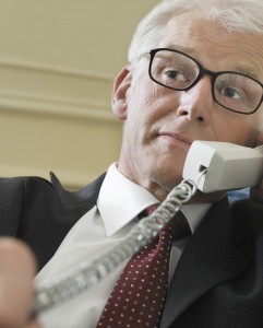 hearing impaired person listening on the phone